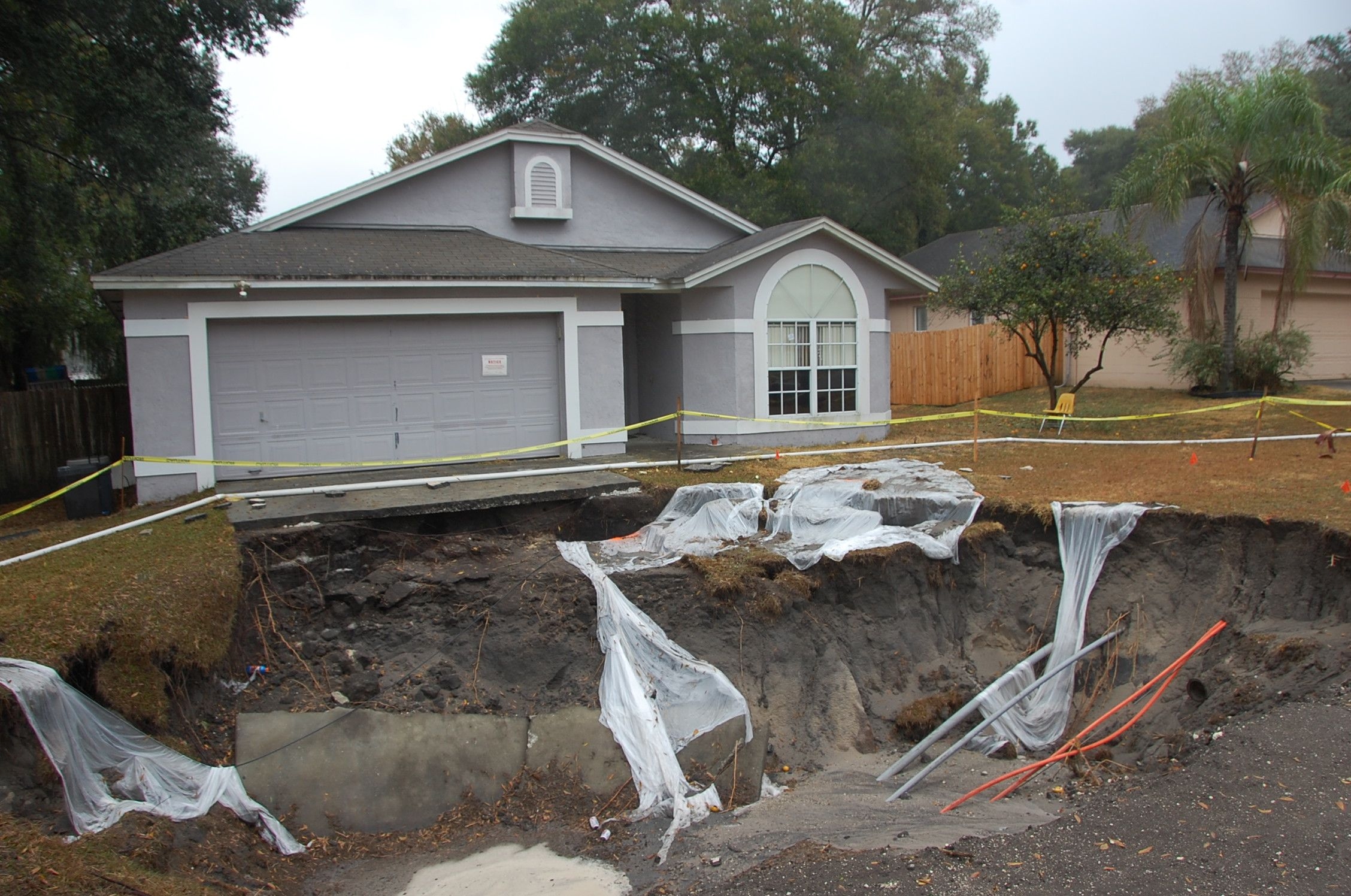 cases of sinkholes under houses and their impact